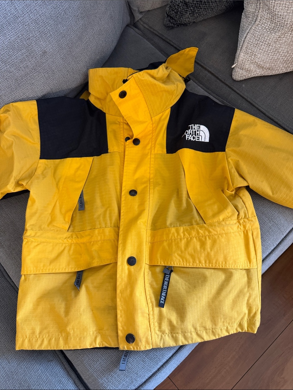 The North Face Kids Yellow and Black Hooded Rain Jacket